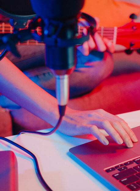 Happy asia girl blogger play guitar and use microphone sing song Happy asia girl blogger play guitar and use microphone sing song record music sound mixer on laptop in modern living room home studio at night. Music content creator, Tutorial, Broadcast concept.